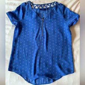 Light blue blouse with white circles